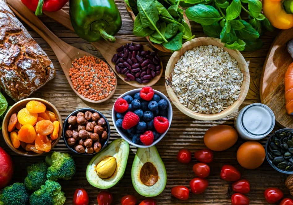 Assorted healthy foods on a wooden table.